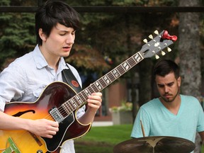 Jacob Starling, left, and Alex Pauze, of the Laurentian Jazz Combo, perform a number during a free concert at the opening day of Jazz Sudbury Festival at Memorial Park in Sudbury, Ont. on Wednesday September 9, 2015. The Sundance Duo followed their performance. John Lappa/Sudbury Star/Postmedia Network