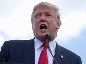In this Sept. 9, 2015 file photo, Republican presidential candidate Donald Trump speaks on Capitol Hill in Washington. A wave of criticism from Republicans and Democrats alike rose Thursday after GOP presidential front-runner Donald Trump insulted the physical appearance of his party's only female White House contender. (AP Photo/Carolyn Kaster, File)