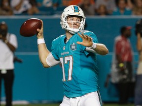 In this Aug. 29, 2015, file photo, Miami Dolphins quarterback Ryan Tannehill looks to pass during the first half of a preseason NFL football game in Miami Gardens, Fla. Tannehill is a possible breakthrough for the 2015 season.(AP Photo/Lynne Sladky, File)