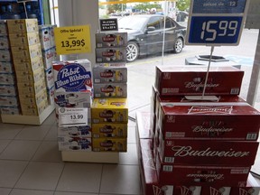 Beer is on display inside a store in Drummondville, Que., on July 23, 2015. A decision from a hearing over a New Brunswick man's bid to bring beer home from Quebec has been reserved until April, 2016. Gerard Comeau launched a constitutional challenge after he was charged with illegally importing alcohol into New Brunswick from neighbouring Quebec. THE CANADIAN PRESS/Ryan Remiorz