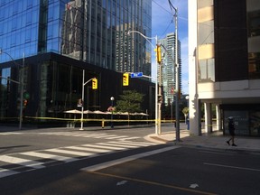 The intersection of Bay and Yorkville is closed off after glass fell from the top of the Four Seasons Hotel Thursday, Sept. 10, 2015. (Craig Robertson/Toronto Sun)