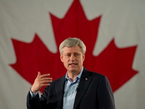 Conservative leader Stephen Harper speaks to supporters during a campaign stop at the refinery in Saint John, Thursday September 10, 2015.. THE CANADIAN PRESS/Adrian Wyld