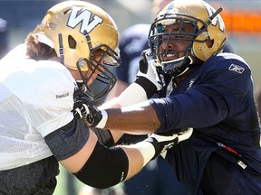 Sam Longo (left) works against Jamaal Westerman in practice. Longo will get the start for the Bombers on the offensive line for the Bombers on Saturday.
