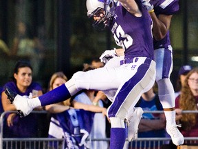 Western Mustangs Harry McMaster and Alex Taylor celebrate in the endzone after Taylor's first quarter touchdown of their OUA game against the York Lions at TD Stadium in London, Ont. on Monday September 7, 2015. (DEREK RUTTAN, The London Free Press)