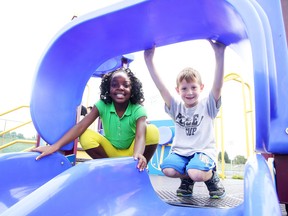 Sienna Ngouabe and Noah Moreau, Grade 2 students at Ecole St. Denis, play on the structure at James Jerome Field on Thursday, September 10, 2015. Gino Donato/Sudbury Star/Postmedia Network