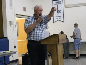 Moderator Ron Broadbridge explains the ground rules for Thursday nightís public meeting at Kente Public School in Ameliasburgh to gather public input on the size of council and ward boundaries in Prince Edward County.
