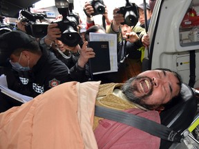 In this March 5, 2015, file photo, South Korean Kim Ki-jong is carried on a stretcher off an ambulance as he arrives at a hospital in Seoul, South Korea. (Han Jong-chan/Yonhap via AP, File)