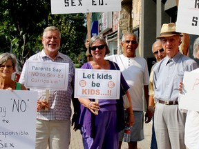 Protesters against Ontario's new sex education curriculum gathered Wednesday, Sept. 2 in front of provincial Liberal candidate Ken Filson's office to condemn the project.