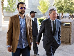Omar Khadr, left, and his lawyer Dennis Edney arrive at Khadr's bail conditions hearing in Edmonton, Alta., on Friday, September 11, 2015. THE CANADIAN PRESS/Jason Franson