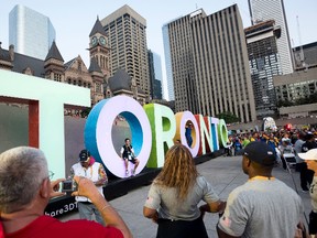 Athletes pose for photos at the closing ceremony of the Parapan Am Games in Toronto on Aug. 15, 2015. The city of Toronto has until Sept. 15 to submit a letter of intent to bid on the 2024 Summer Olympics. (Darren Calabrese/THE CANADIAN PRESS)