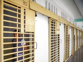 A Cuban inmate remains in his cell at the maximum security "Combinado del Este" prison, in Havana, on April 9, 2013.Cuba's government announced pardons on September 11, 2015 for more than 3,500 prisoners, setting the stage for an eagerly awaited visit by Pope Francis with the largest release of its kind since the 1959 revolution. The official Communist Party daily Granma published the decision by the Council of State to free 3,522 prisoners "on the occasion of the visit of His Holiness Pope Francis."  AFP PHOTO/Adalberto ROQUE