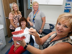 Luke Hendry/The Intelligencer 
Hastings Prince Edward Public Health dental staff show off one of their rooms in the new building in Belleville Friday. In front is certified dental assistant Cathy Anderson. Behind her from left are hygienist Kelly Palmateer, dental assistant Christine Fox and hygienist Catherine Willock. Not pictured: hygienist Carrie Rebello and dental assistant Samantha Dafoe.