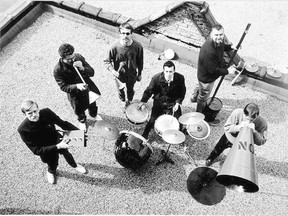 The late Don Vincent?s photograph of the Nihilist Spasm Band, atop Greg Curnoe?s studio in May 1966, shows Murray Favro on drums and, from left, Art Pratten, John Boyle, Greg Curnoe, Hugh McIntyre and Bill Exley. (Collection of Museum London, gift of Bernice Vincent)