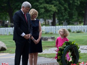 Conservative Leader Stephen Harper and wife Laureen 
lay a wreath to honour Canadian victims of the 9/11 terrorist attacks.