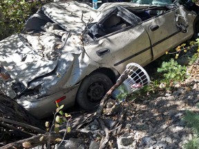 This Thursday, Sept. 10, 2015 photo provided by the Utah County Sheriff's Office shows the area where a woman in her car plunged off the side of road in American Fork Canyon southeast of Salt Lake City. Heather Blackwelder had spent two days in the wreckage until she was found by a young couple who heard her screaming Thursday. (Deputy J. Phillippi/Utah County Sheriff's Office via AP)
