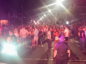 On Sunday, Kingston Police estimated more than 2,000 students gathered at the university's centre from 11:30 p.m. to 2:30 a.m. and forced officers to temporary close University Avenue. While officers contained the scene, a beer bottle was thrown at a marked cruiser. (Kingston Police)