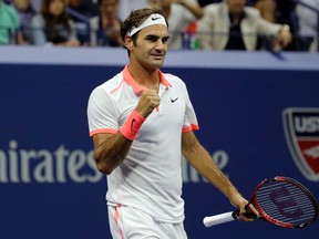 Roger Federer, of Switzerland, reacts after beating Stan Wawrinka, of Switzerland, during a semifinal match at the U.S. Open tennis tournament, Friday, Sept. 11, 2015, in New York. (AP Photo/Bill Kostroun)