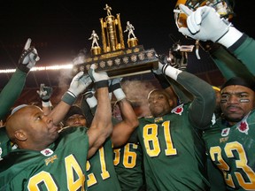 Edmonton Eskimos (including current GM Ed Hervey, 81) hoist the Western Final trophy after defeating the Saskatchewan Roughriders at Commonwealth Stadium on Nov 9, 2003. That was the last time the Eskimos have hosted the Western final. EDMONTON SUN FILE