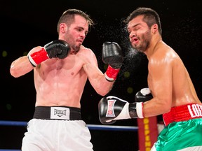 Randy Lozano (right) of Mexico fights Cam O'Connell of Red Deer during the title fight of a KO Boxing card at the Shaw Conference Centre in Edmonton, Alta., on Friday September 11, 2015. O'Connell won by decision. Ian Kucerak/Edmonton Sun/Postmedia Network