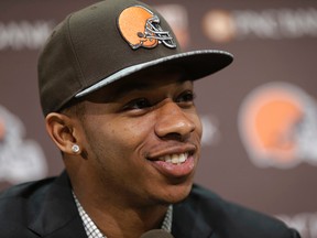 In this May 9, 2014, file photo, Cleveland Browns cornerback Justin Gilbert smiles during his introductory news conference at the NFL football team's facility in Berea, Ohio. (AP Photo/Tony Dejak, File)