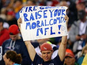 A fan holds a sign directed at NFL commissioner Roger Goodell in the game between the New England Patriots and the Pittsburgh Steelers at Gillette Stadium in Foxboro, Mass., on Sept. 10, 2015. (Maddie Meyer/Getty Images/AFP)