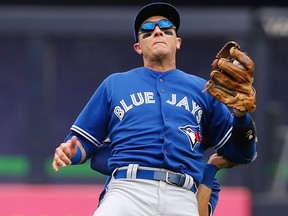 Blue Jays shortstop Troy Tulowitzki reacts as he collides with Blue centre fielder Kevin Pillar fielding a second-inning fly ball against the New York Yankees in Game 1 of their doubleheader yesterday at Yankee Stadium in New York. (AP/PHOTO)