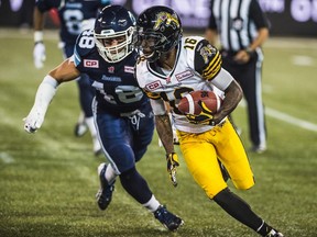 Hamilton Tiger-Cats' Brandon Banks is chased by Toronto Argonauts' Miles Thomas during second half CFL action in Toronto on Friday, September 11, 2015. Hamilton won 35-27. THE CANADIAN PRESS/Aaron Vincent Elkaim