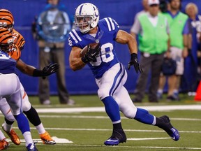 Tyler Varga #38 of the Indianapolis Colts runs the ball against the Cincinnati Bengals at Lucas Oil Stadium on September 3, 2015 in Indianapolis, Indiana.   Michael Hickey/Getty Images/AFP