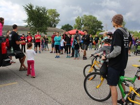 Kevin VanReenen addresses participants before the start of Reanna's Cycle of Hope on Saturday September 12, 2015 in Sarnia, Ont. About 75 participants turned up to either ride their bikes or walk in honour of late Sarnia teen Reanna Pyne. Proceeds from the fundraiser were earmarked for a local Make a Wish recipient and for two recent SCITS graduates. Barbara Simpson/Sarnia Observer/Postmedia Network
