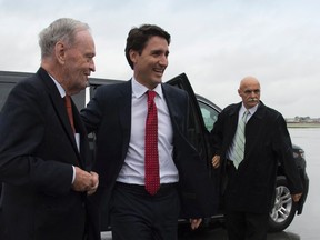 Liberal leader Justin Trudeau and former prime minister Jean Chretien arrive at the Liberal campaign plane in Montreal, on Sept.13, 2015. (THE CANADIAN PRESS/Jonathan Hayward)