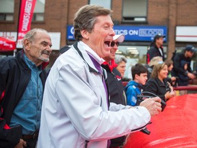 Toronto Mayor John Tory tries his hand at radio-controlled cars on Sunday at the Taste of the Kingsway Festival along Bloor St W.  (ERNEST DOROSZUK, Toronto Sun)