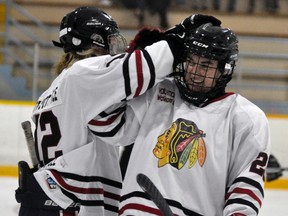Lucas Spence (left) and Jake Finlayson celebrate a goal during their 5-3 pre-season loss to Exeter last Friday, Sept. 11 at the Mitchell & District Arena.  ANDY BADER/MITCHELL ADVOCATE