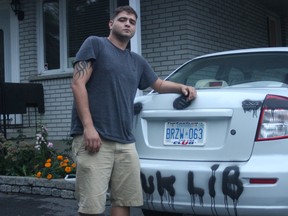 Ji Wehbe said he was "devastated" to see the damage done to his car overnight Saturday, September 12, 2015. At least five other properties in his neighbourhood had spray paint damage done. (Corey Larocque, Ottawa Sun)