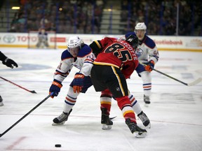 Edmonton Oilers' Braden Christoffer Calgary Flames' Louick Marcotte during 3 rd period in Young Stars game at  Penticton, BC on September12 2015. Perry Mah/Edmonton Sun/Postmedia Network