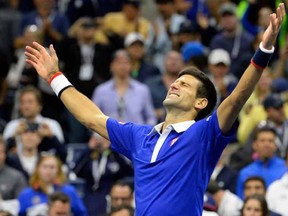 Novak Djokovic of Serbia celebrates after beating Roger Federer of Switzerland in the men's singles final on day fourteen of the 2015 U.S. Open tennis tournament at USTA Billie Jean King National Tennis Center.

Robert Deutsch-USA TODAY Sports