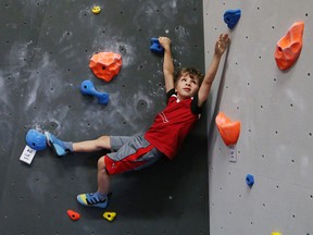 Adrian Aho, 6, takes part in the ARC Flash Bouldering Competition 2015 in Sudbury, Ont. on Friday September 11, 2015. John Lappa/Sudbury Star/Postmedia Network