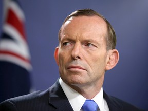 In this Sept. 19, 2014 file photo, Australian Prime Minister Tony Abbott speaks during a press conference, in Sydney. (AP Photo/Rick Rycroft, File)
