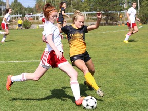 Emily McMullan, left, of Loyalist College, and Courtney Ceccarelli, of Cambrian College, battle for possession of the ball during women's varsity soccer action at Cambrian College in Sudbury, Ont. on Sunday September 13, 2015. John Lappa/Sudbury Star/Postmedia Network