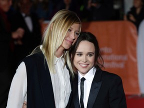 Ellen Page with friend Samantha Thomas pose on the red carpet at Roy Thomson Hall for the movie Freeheld during the Toronto International Film Festival in Toronto on Sunday September 13, 2015. (Craig Robertson/Postmedia Network)