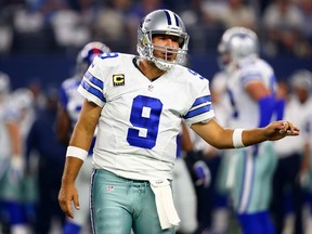 Tony Romo #9 of the Dallas Cowboys talks with an official in the first quarter against the New York Giants at AT&T Stadium on September 13, 2015 in Arlington, Texas.   Ronald Martinez/Getty Images/AFP