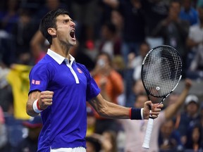 Novak Djokovic reacts after winning a game against Roger Federer during the U.S. Open final at the USTA Billie Jean King National Tennis Center in New York on September 13, 2015. (AFP PHOTO/JEWEL SAMAD)