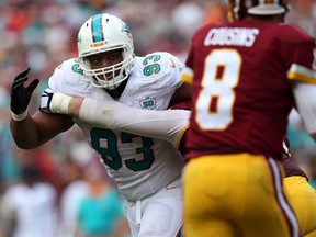 Defensive tackle Ndamukong Suh #93 of the Miami Dolphins defends in the first half during a game against the Washington Redskins at FedExField on September 13, 2015 in Landover, Maryland. (Patrick Smith/Getty Images/AFP)