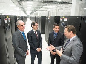 Finance Minister Greg Dewar, MTS CEO Jay Forbes, Winnipeg Mayor Brian Bowman, and MTS Data Centres GM Ryan Klassen, at the grand opening of MTS Data Centre. (DAVID LIPNOWSKI/MTS PHOTO)