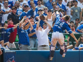 Toronto Blue Jays catcher Russell Martin eyes the ball during 7th inning action against the Baltimore Orioles at the Rogers Centre in Toronto on Saturday September 5, 2015. (Ernest Doroszuk/Toronto Sun)