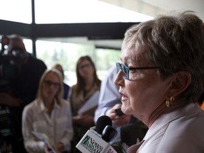 Dr. Marcia Johnson (right), medical officer of health for Alberta Health Services , speaks about two new cases of measles in Edmonton Zone residents at a press conference in Edmonton, Alta., on Tuesday, May 27, 2014. Ian Kucerak/Edmonton Sun