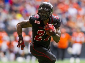 Ottawa Redblacks RB Jeremiah Johnson runs the ball against the B.C Lions during the second half of their CFL football game in Vancouver, British Columbia, September 13, 2015. REUTERS/Ben Nelms