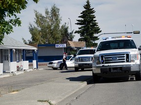 Mounties converged at the Blue Mountain Motel on Main St. and Waterton Ave. in Pincher Creek, Alta. after receiving a call about a dead man in one of the rooms on Sunday, Sept. 13 around 2:00 in the afternoon. John Stoesser photo/Pincher Creek Echo.