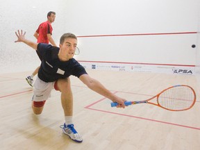 Elliot Selby stretches for a backhand return shot while playing fellow Englishman Lyell Fuller in the Nash Cup squash tournament at the London Squash and Fitness Club on Monday. Fuller won 11-6, 11-5, 11-6. (DEREK RUTTAN, The London Free Press)