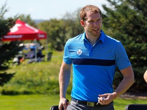 Maple Leafs goalie James Reimer tees off at the annual Leafs and Legends golf tournament at RattleSnake point in Milton yesterday. Reimer is in the final year of his contract. (Michael Peake/Toronto Sun)