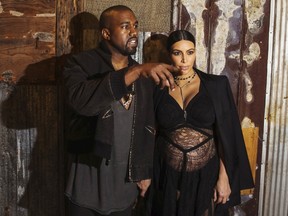 Kanye West stands with his wife Kim Kardashian after watching the Givenchy Spring/Summer 2016 collection during New York Fashion Week in New York September 11, 2015.  REUTERS/Lucas Jackson